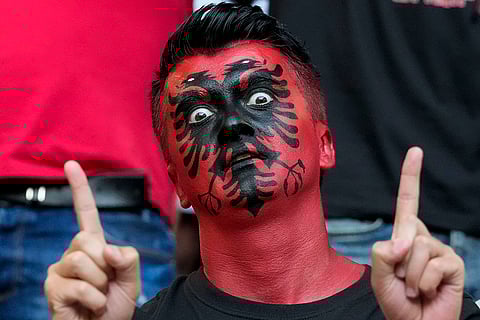 A fan cheers Albania's team